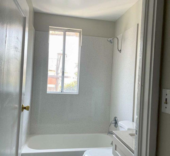newly renovated bathroom with bath tub and shower