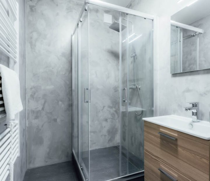 Contemporary bathroom with shower and sink with wooden cabinet